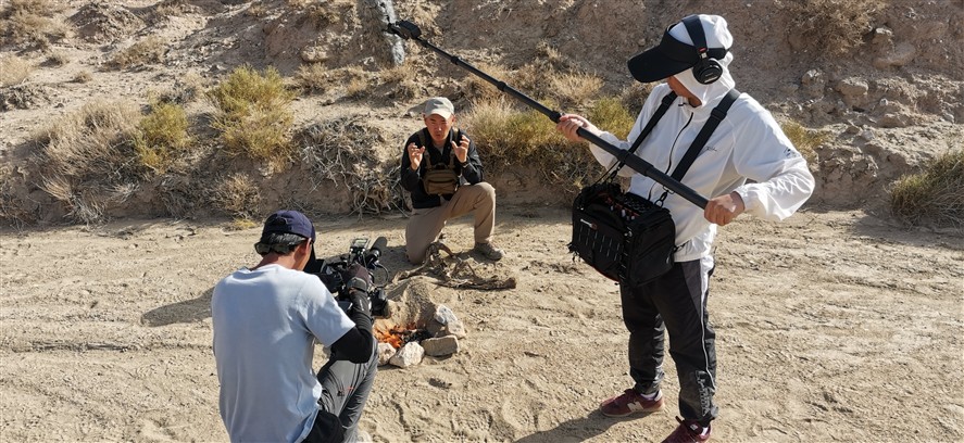 Tianjin production crew reviewing a shoot on location